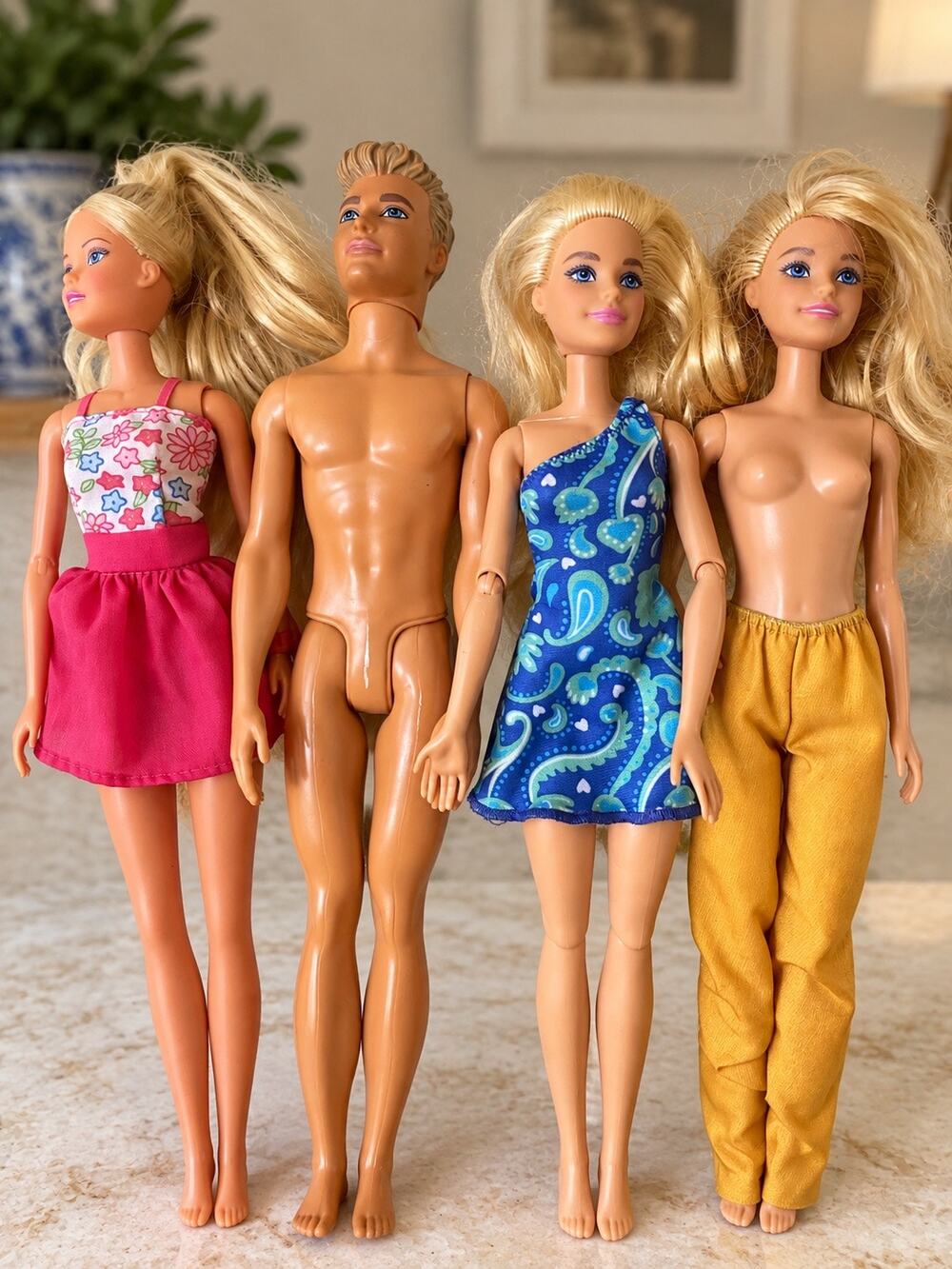 Mattel Barbie and Ken Beach doll set featuring molded swim trunks and rooted